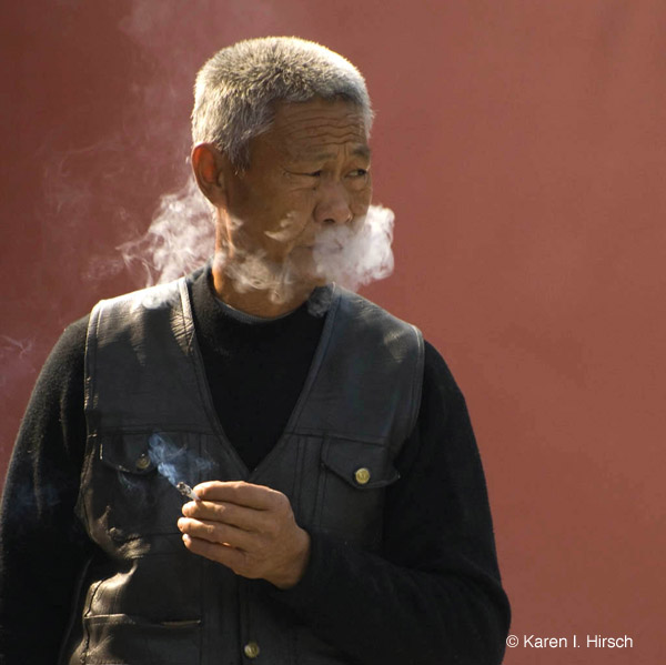Old Chinese man smoking