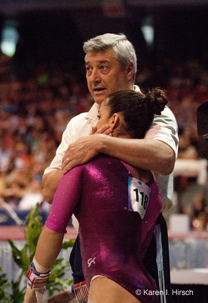 Aly  Raisman and coach at gymnastic meet