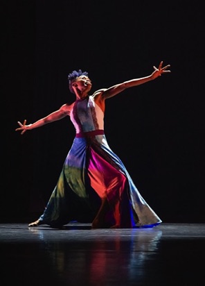 Female African-American dancer with outstretched arms